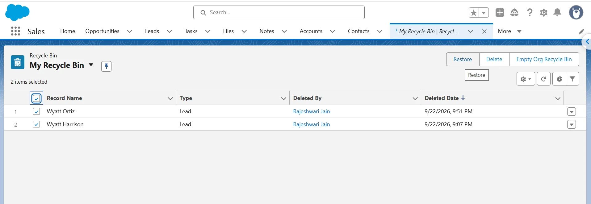 Salesforce Recycle Bin with multiple Lead records selected and the Restore button highlighted.